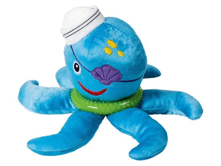 Een blauwe octopus knuffel met een piratenooglapje en een groene ring