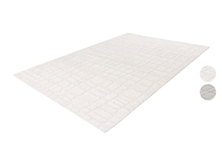 Gebroken wit rechthoekig vloerkleed met getextureerd patroon en twee kleurstaaltjes.