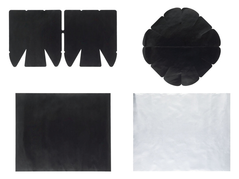 Zwarte kartonnen dozen, een ronde cakevorm en aluminiumfolie.