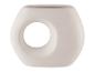 Een witte, ronde, ovale pot met een gat in het midden.