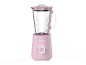 Roze blender met glazen kan en zilveren bedieningsknop.
