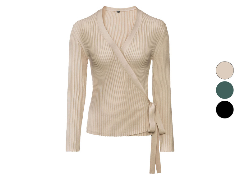 Beige gebreide trui met V-hals en strik.