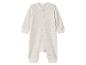 Witte baby romper met gouden sterren en drukknopen.