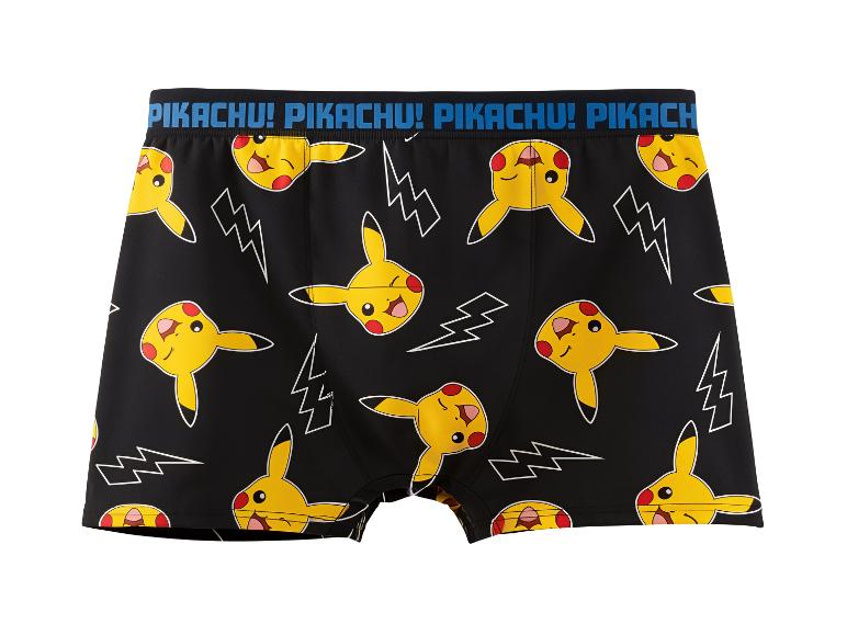 Zwarte boxershorts met gele cartoonfiguren en witte bliksemschichten.