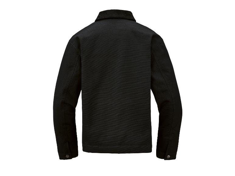 Zwart werkjasje met corduroy kraag, van achteren gezien.