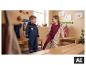 Kinderen in gevoerde LUPILU® regenoveralls in een kleedkamer. [AI-gegenereerde afbeelding]