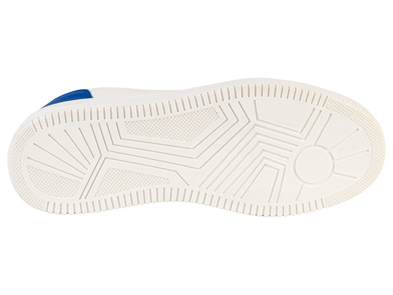 Witte sneakerzool met een geribbeld patroon.