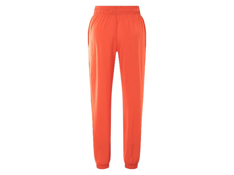 Oranje joggingbroek met elastische tailleband.