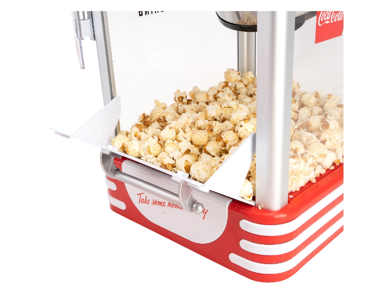 Popcornmachine met verse popcorn, in een retro rood-wit design.