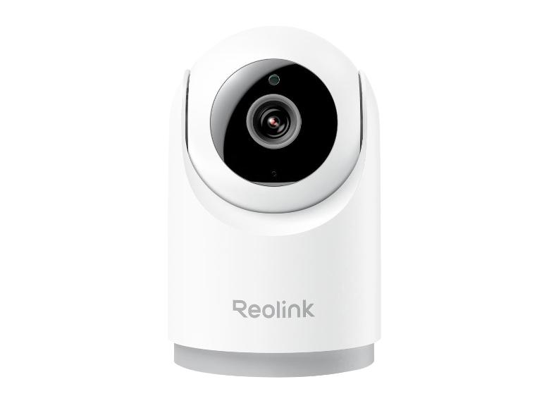 Witte binnencamera met een ronde zwarte lens en een grijze basis.