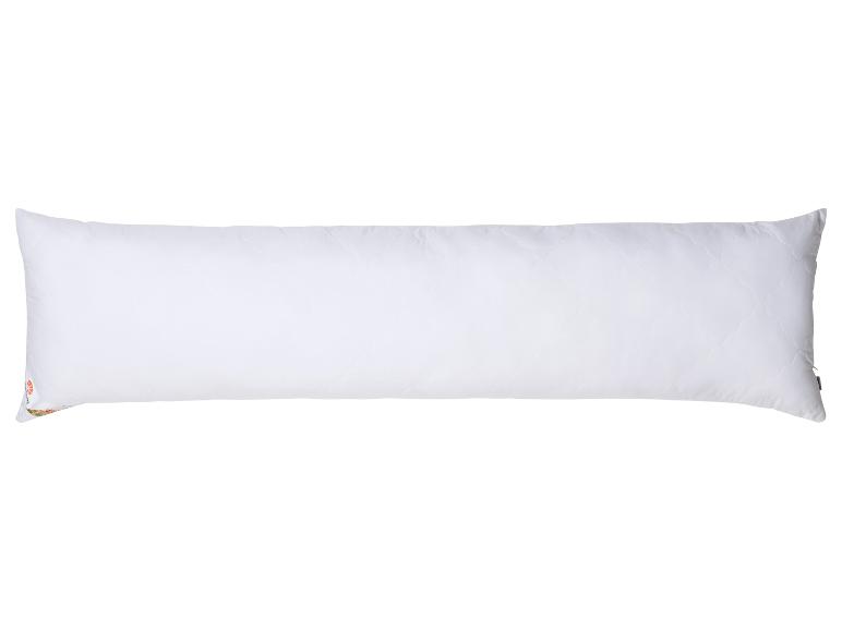 Een groot wit kussen met rits.