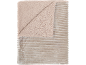 Beige sherpa en geribbelde fluwelen deken.