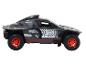 Een grijs Audi e-tron rallymodel met rode velgen.