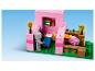 LEGO Minecraft set met een roze huis, een skelet en een varken.