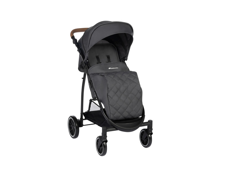 Een zwarte Babycomfort buggy met een quilted bekleding.