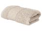 Opgevouwen beige handdoek met decoratieve band