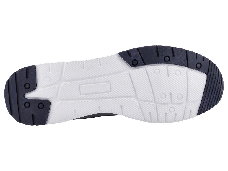 Witte en zwarte sportschoenzool met antislip patroon