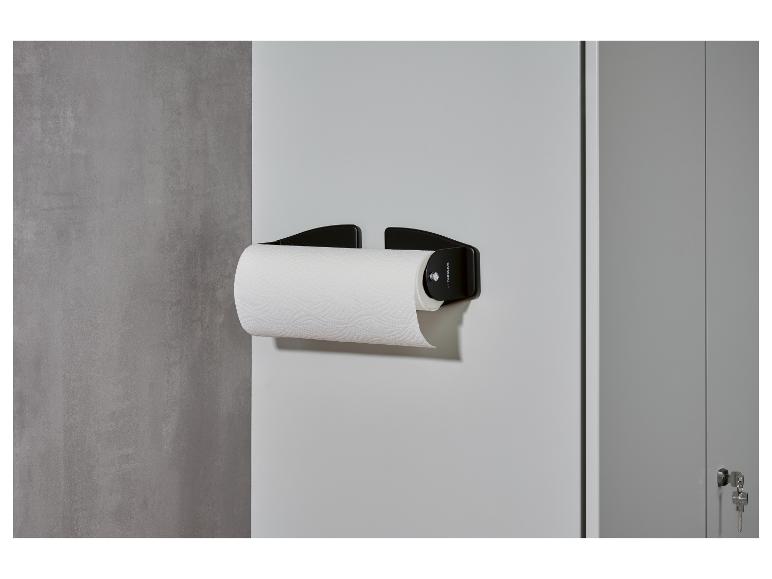 Zwarte PARKSIDE keukenrolhouder aan de muur met een rol papier.