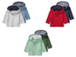 Drie sets baby-hoodies in grijs, rood en groen.
