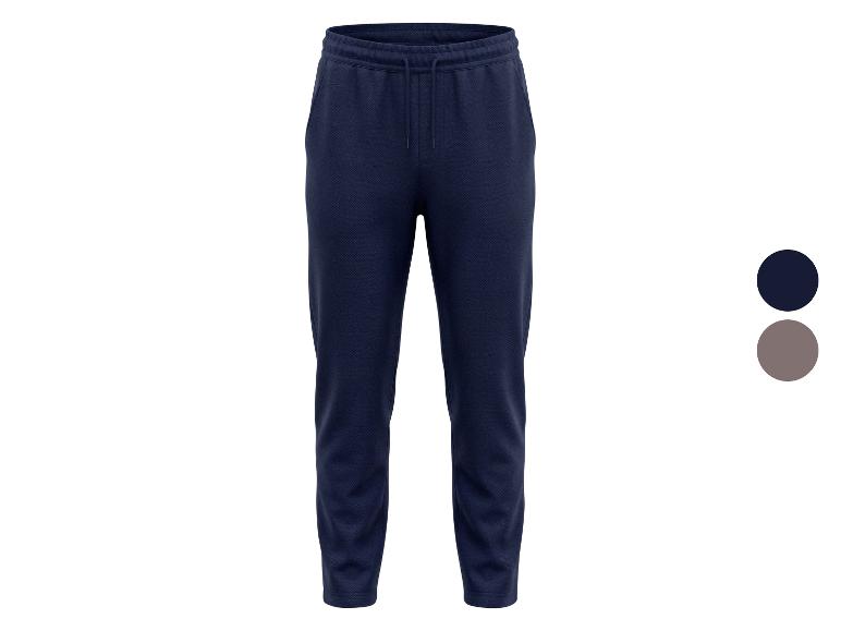 Donkerblauwe joggingbroek met trekkoord en zakken, met een grijze kleuroptie.