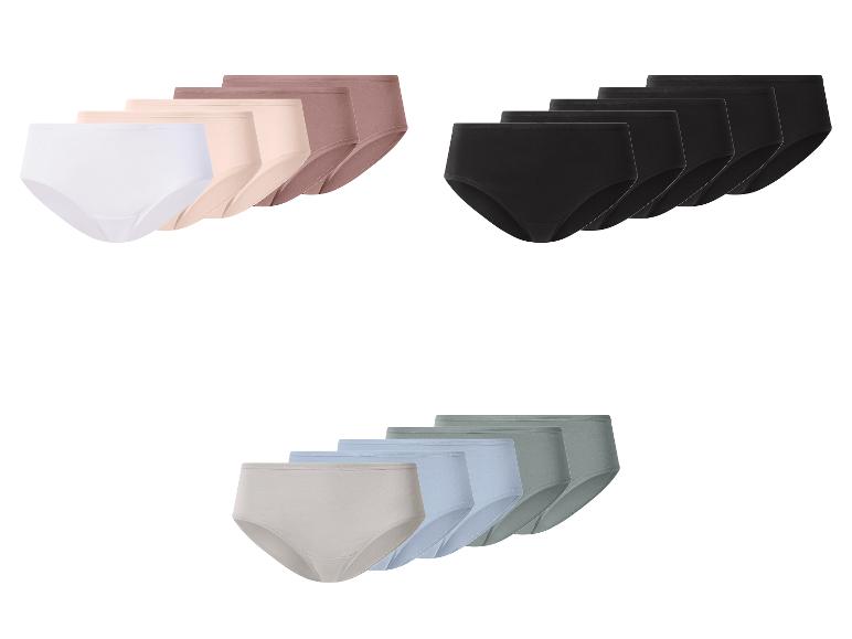 Drie verpakkingen damesonderbroeken in wit, zwart en neutrale kleuren.