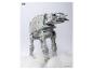 Grijs AT-AT speelgoed in de sneeuw met Star Wars logo.