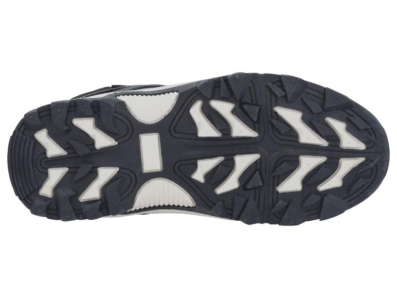 Zool van een zwarte wandelschoen met witte details.