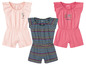 Drie babyjumpsuits van Lupilu: roze met bloemmotief, gestreept en roze met 'Happy little one'.
