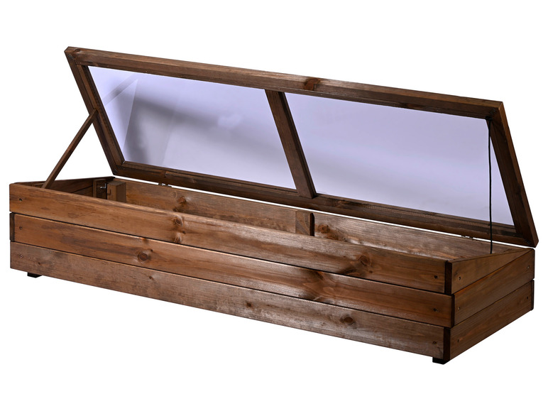 Een houten kas met een glazen deksel.