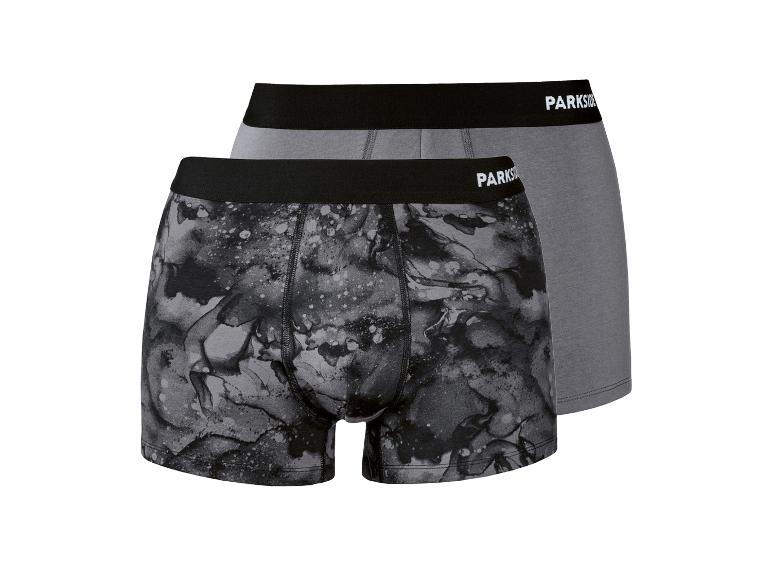 Twee katoenen boxershorts voor heren, één grijs en één met een grijs marmerpatroon.