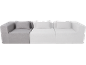 Modulaire driezitsbank met kussens, één grijs en twee witte modules.