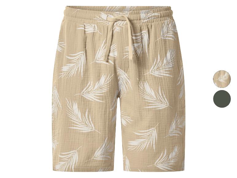 Beige linnen shorts met witte bladprint en verstelbaar trekkoord.