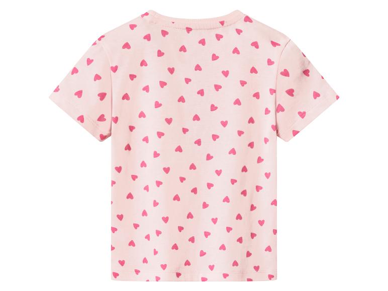 Roze T-shirt met korte mouwen en een all-over hartjesprint op de rug.