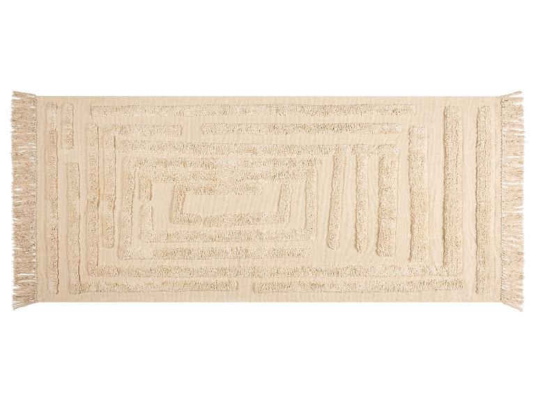 Beige rechthoekig vloerkleed met een geometrisch reliëfpatroon en franjes.