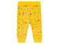 Gele babybroek met huisjesprint.