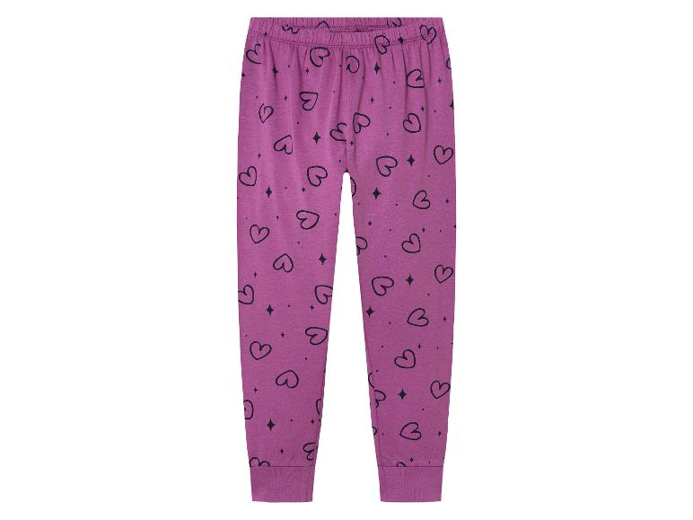 Roze kinder pyjamabroek met hartjes print.