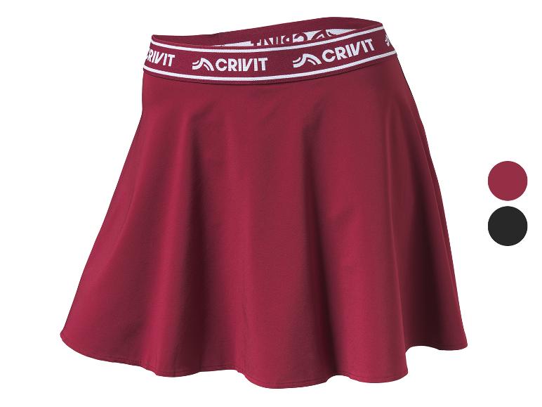 Bordeauxrode dames sportrok met elastische tailleband met de tekst 'CRIVIT'.