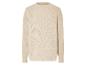 Beige trui met een opengewerkt patroon.