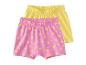 Twee meisjes shorts, één roze met zonnetjes en één geel.