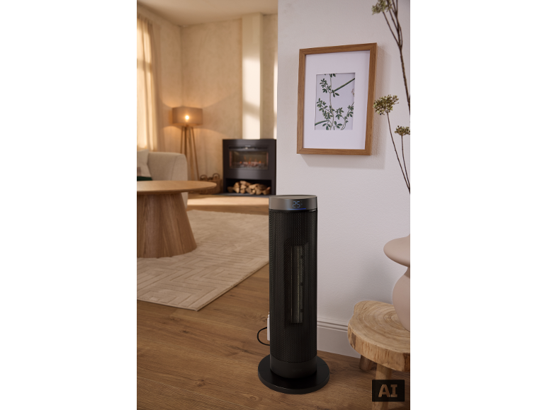 Zwarte torenverwarming met 25°C display in een moderne woonkamer.