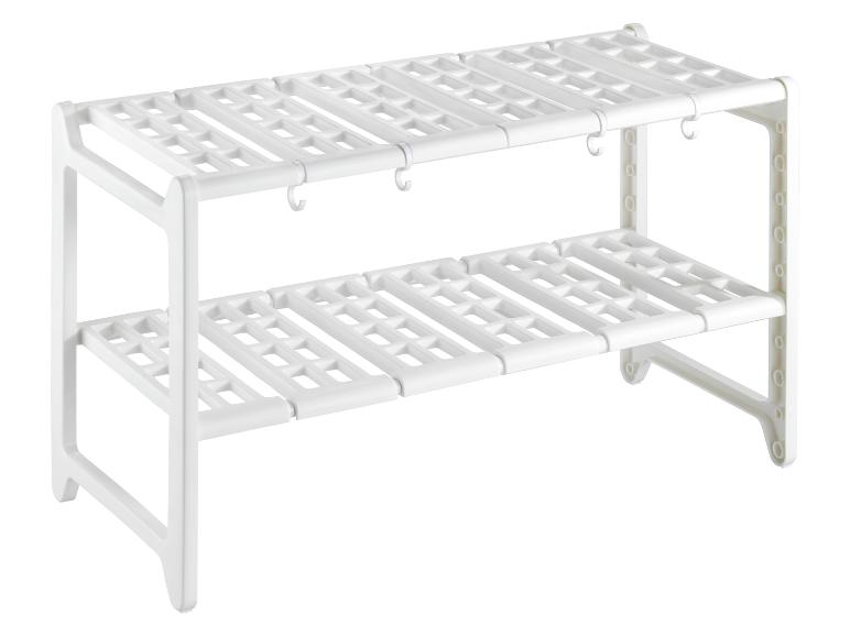 Witte twee-laags opbergplank met haken.