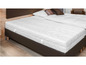 Een wit matras met een bruine boxspring.