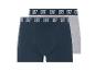 Twee katoenen boxershorts, één marineblauw en één grijs, met een elastische tailleband.