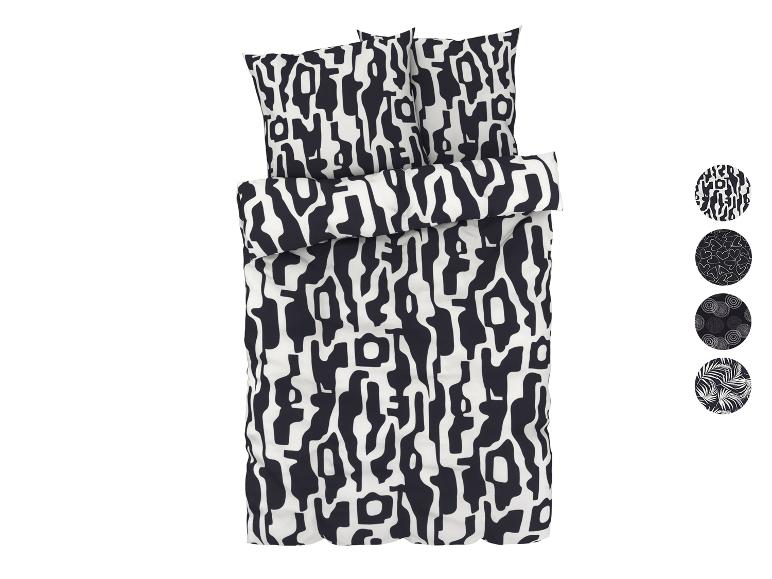 Een zwart-wit dekbedovertrek met een abstract patroon.
