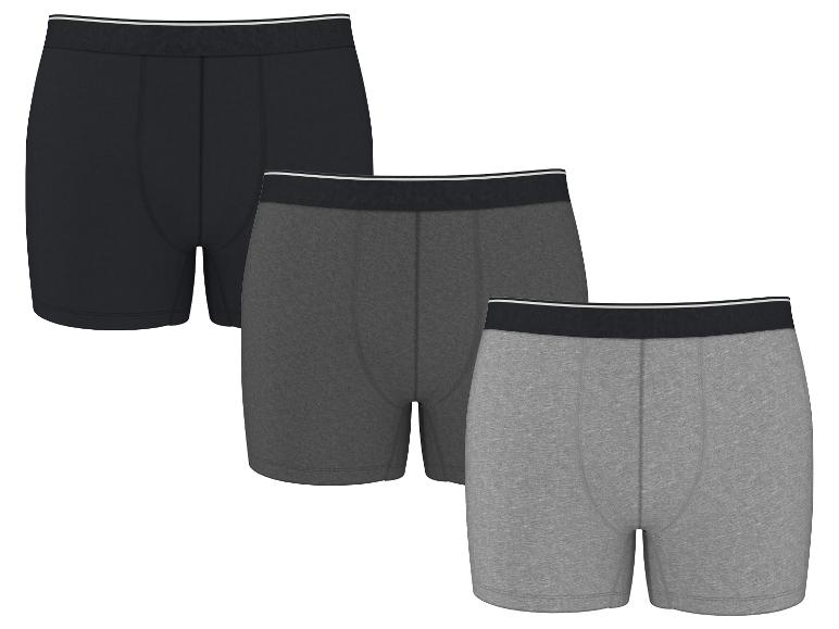 Set van drie herenboxershorts in zwart, donkergrijs en lichtgrijs.