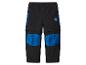 Kinder 2-in-1 outdoorbroek, zwart met blauwe accenten en logopatch