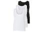 Twee witte en één zwarte tanktops.