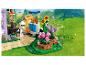 LEGO Friends set met imker, bijenkorven en bloemen in een groen landschap.