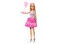 Barbiepop in feestkleding met roze ballon en zilveren tas.