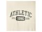 Geborduurde tekst 'ATHLETIC 1986' op een beige achtergrond.